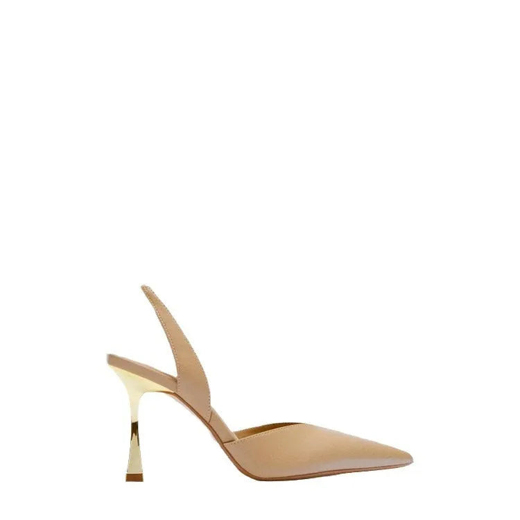 Women's pointed-toe patent leather high heels in apricot and black, showing shallow-cut vamp design.