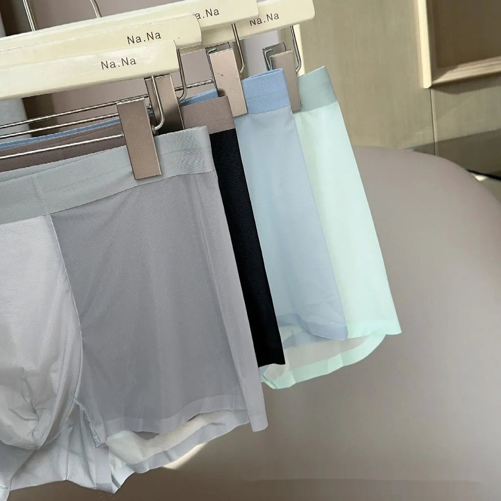 Ultra-thin seamless men's ice silk boxers with a honeycomb crotch panel, shown in multiple colours.