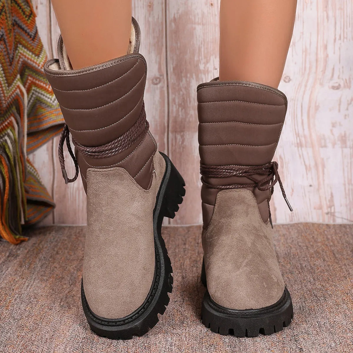 Women's black suede chunky heel snow boots with lace-up design and fleece lining.