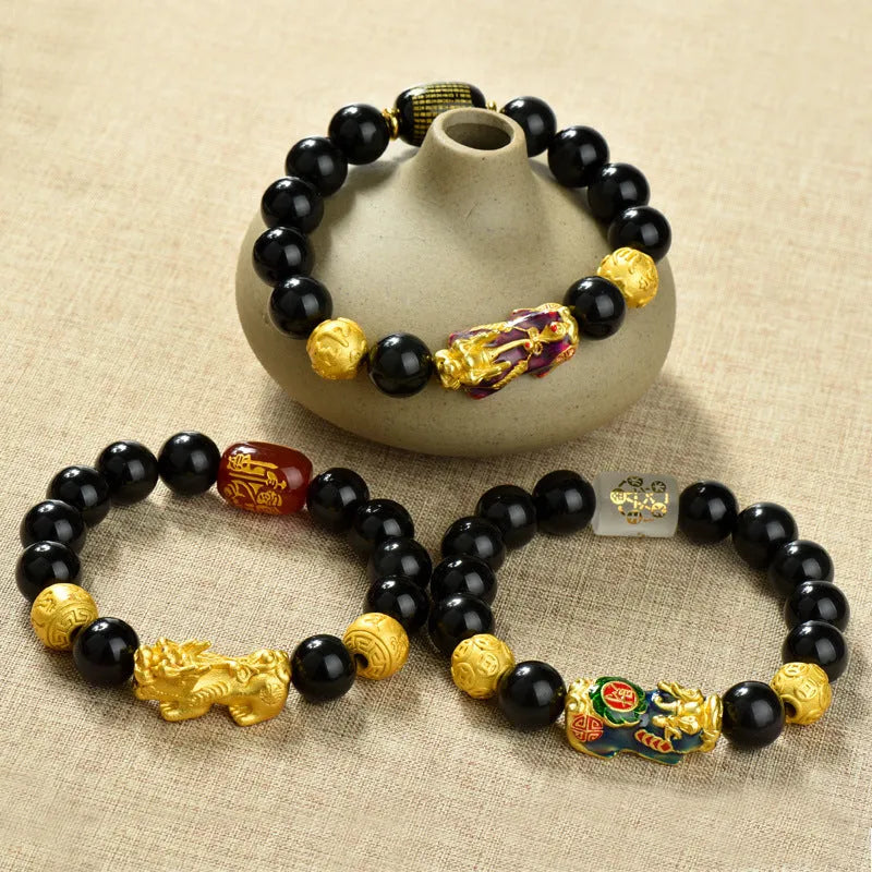 Natural obsidian temperature-sensitive colour change bracelet with gold accents and Pi Xiu motif