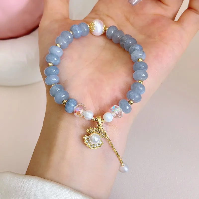 Natural aquamarine pearl and shell bracelet on adjustable stretch cord