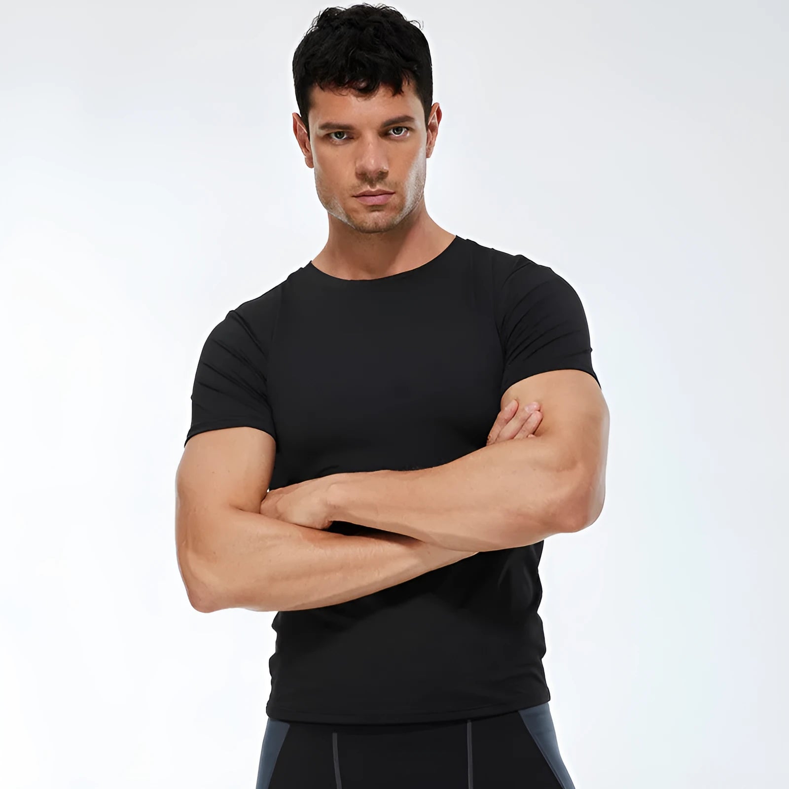 Men's solid colour short-sleeved quick-drying stretch shirt for fitness exercise on a hanger
