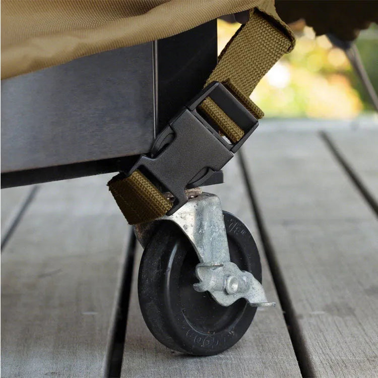 Beige ribbed polyester barbecue cover shown draped over a garden grill in a Nordic style.