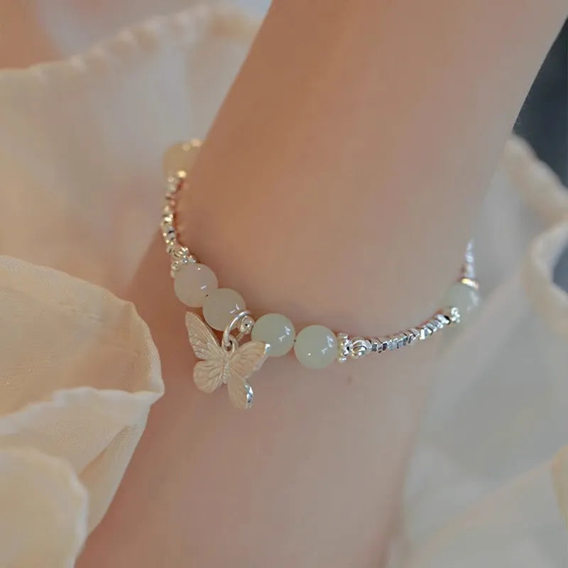Women's butterfly jewellery set with bracelet and necklace featuring silver electroplated finish and Hetian jade details
