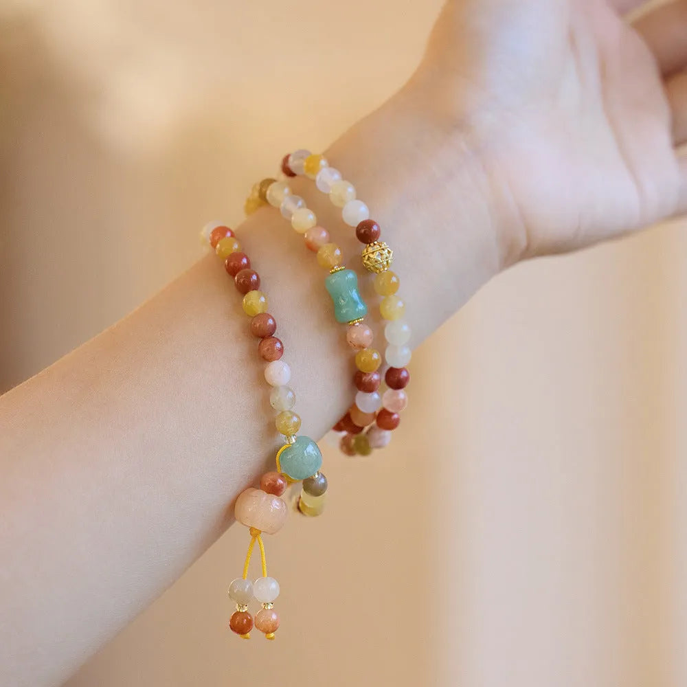 Women's handcrafted three-circle pumpkin tassel bracelet in Jinsi Jade
