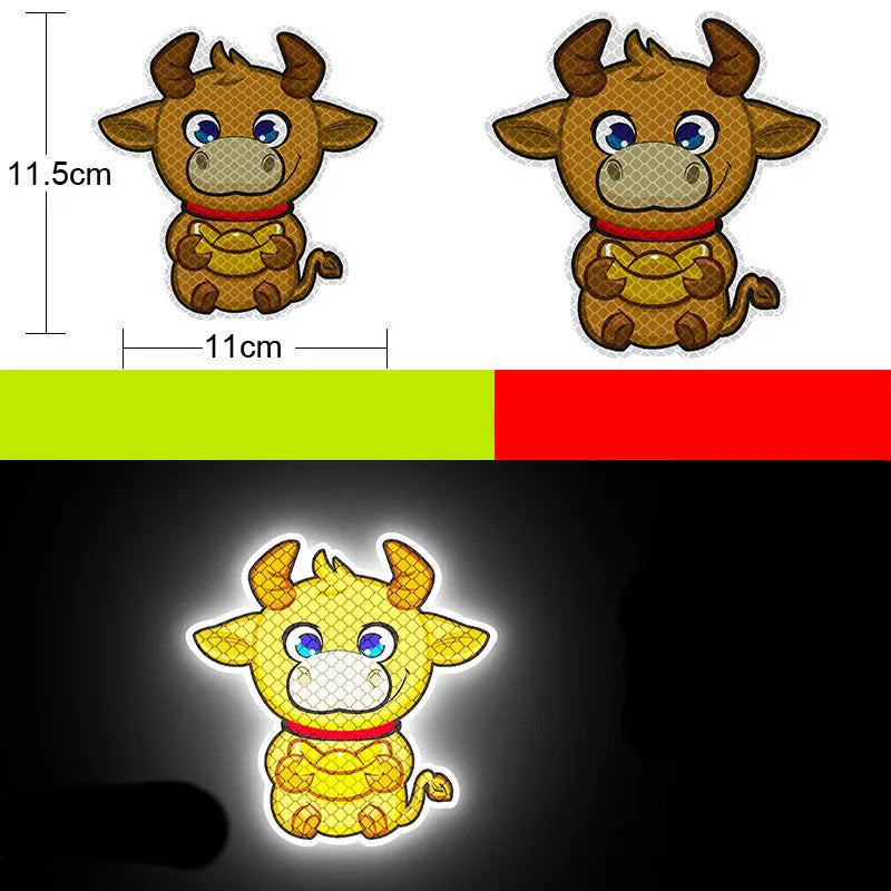 Pair of 9x5cm reflective warning stickers for cars and motorcycles showing sample graphic designs on diamond-grade film.