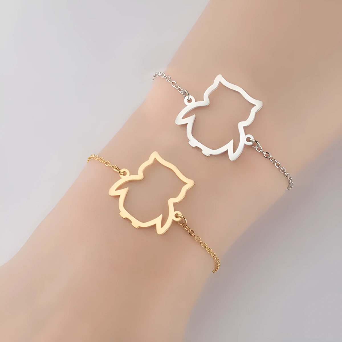 Stainless steel bracelet with small hollow owl pendant on simple chain