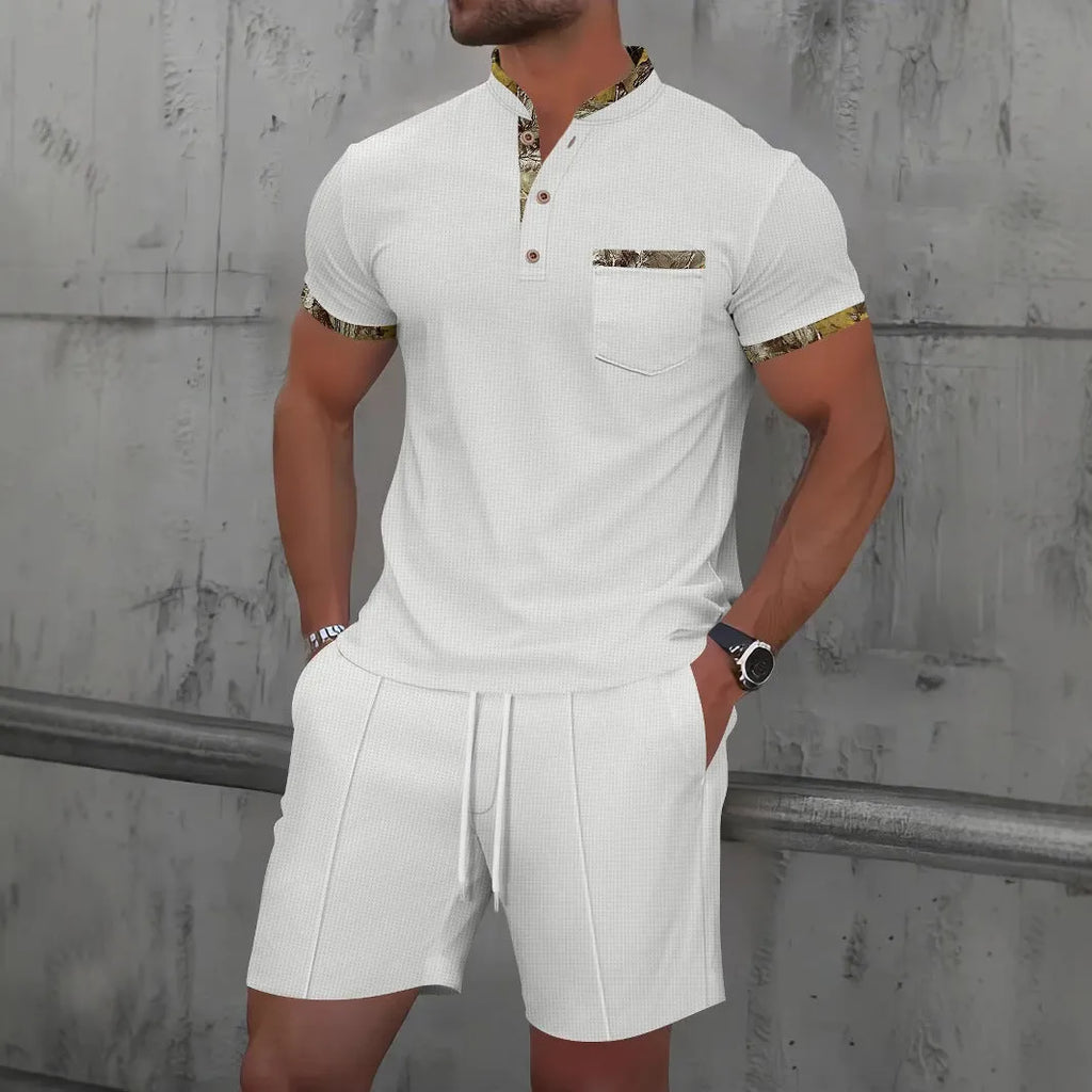 Men's grey zip-front polo collar tracksuit top and shorts set laid flat.