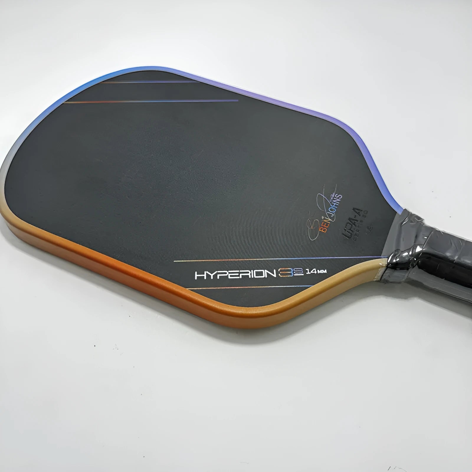 Aurora Multicolor Hyperion 3s pickleball racket with matte Teflon pattern carbon fibre face.