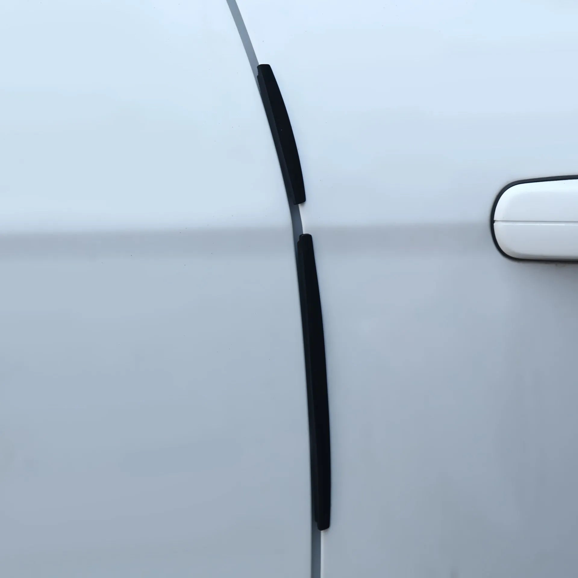 White solid colour plastic car door edge protector strip anti-collision trim.