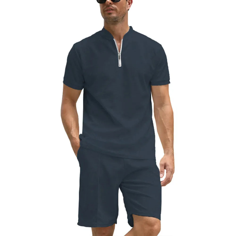 Men's solid colour polo shirt and matching trousers two-piece set in textured fabric.