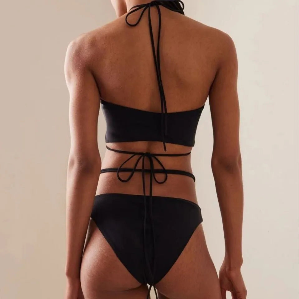 Women's black lace-up bikini swimsuit with adjustable design and quick-drying fabric