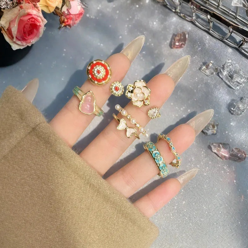 Adjustable copper ring with New Chinese style gourd, flower, and bow design in a vintage oil drip pattern.