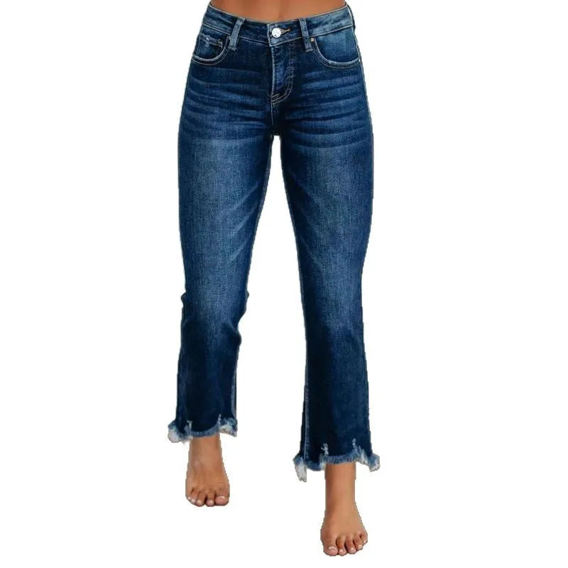 Women's solid blue casual denim trousers with a hand-worn finish on a hanger.