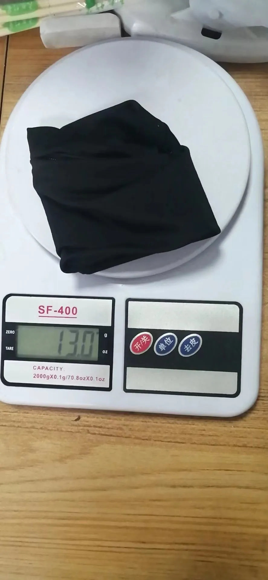 Adjustable wrist armband with a phone compartment, shown for camping and fitness use.