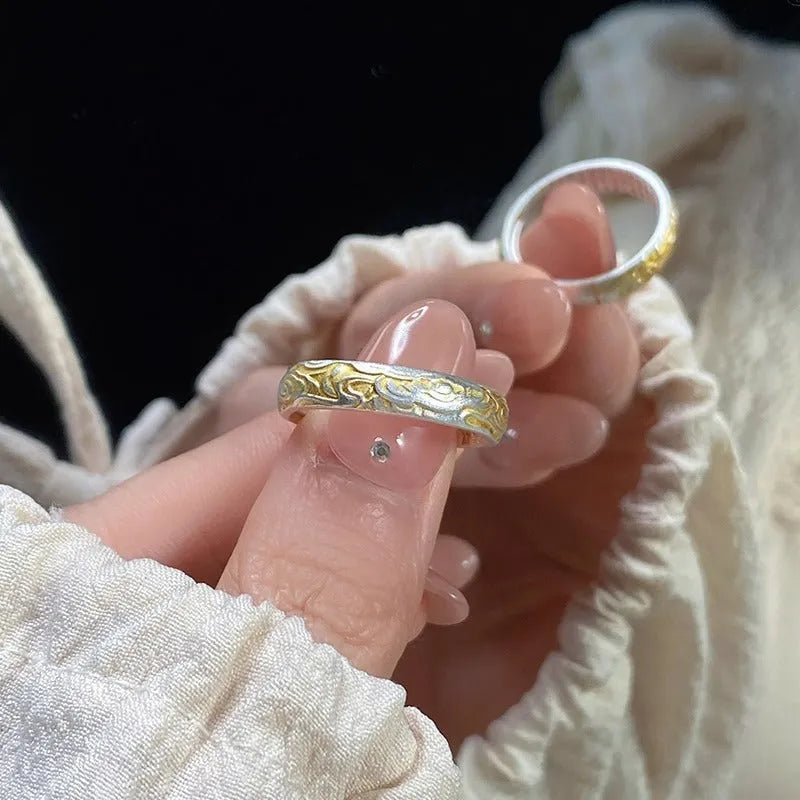 Open mouth silver gold ring with geometric Chinese Xiangyun cloud pattern.