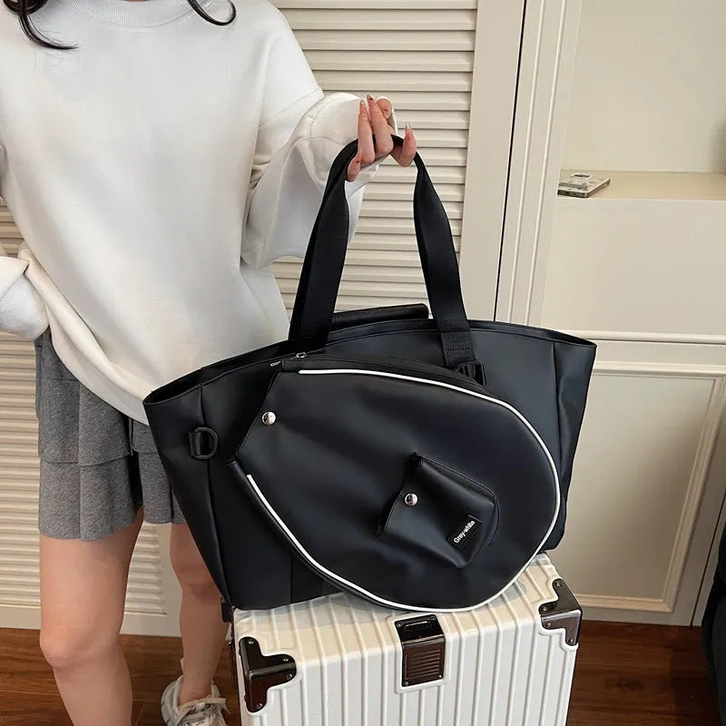 Large black one-shoulder yoga storage bag with a breathable lining and 36-55 litre capacity