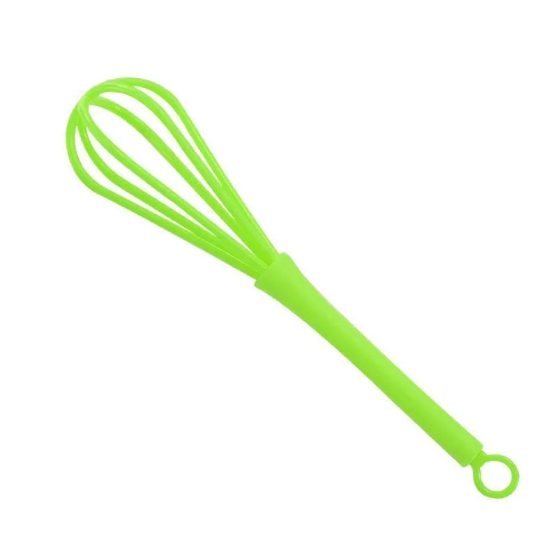 Plastic creative mini manual eggbeater in green and yellow, size 4x18.5 cm, on kitchen counter