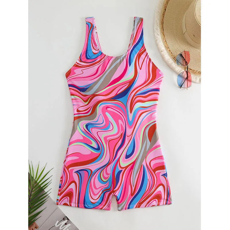 Woman modelling a printed high-waist, backless one-piece swimsuit in polyester fabric.