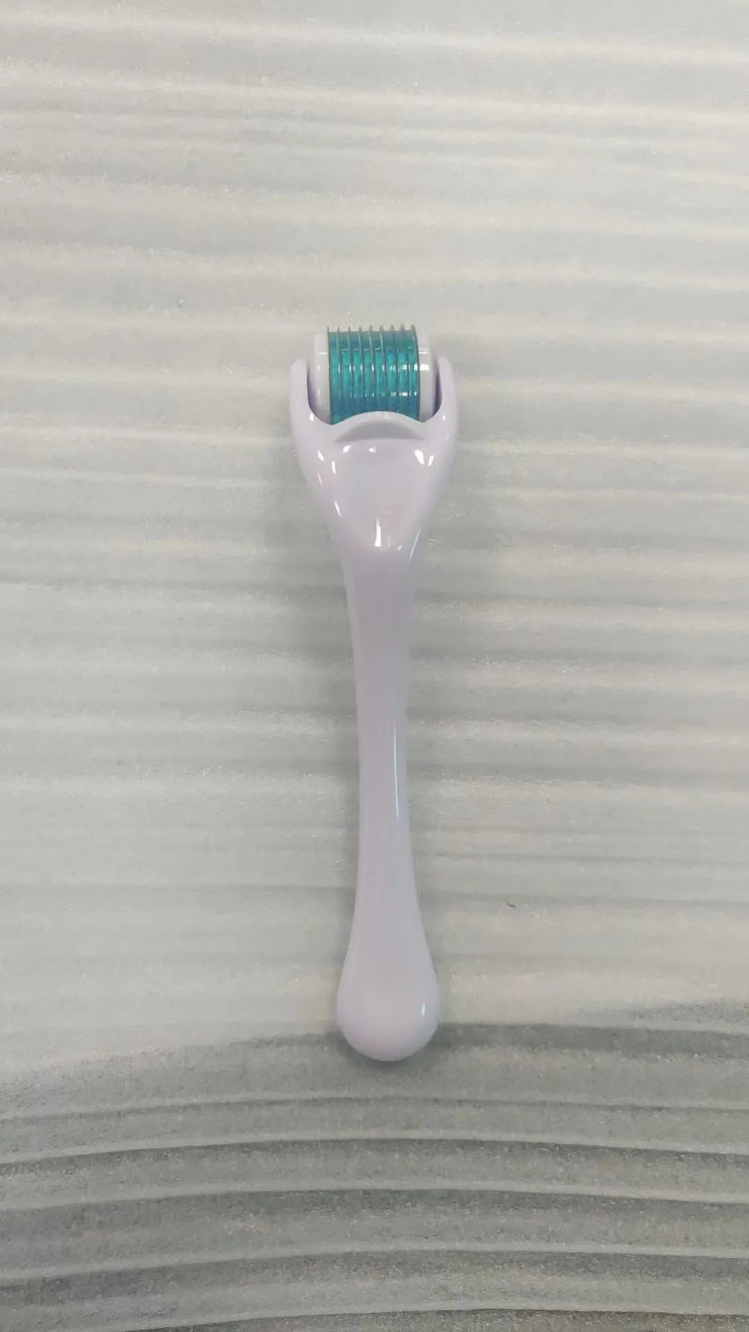 540 micro needle mechanical derma roller with black handle and coloured wheel options
