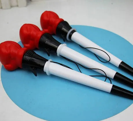 Four black pressure relief pens with boxing press ejection mechanism and 0.7mm bullet tips