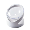 White elevated cat food bowl with a tilted surface on a raised platform.