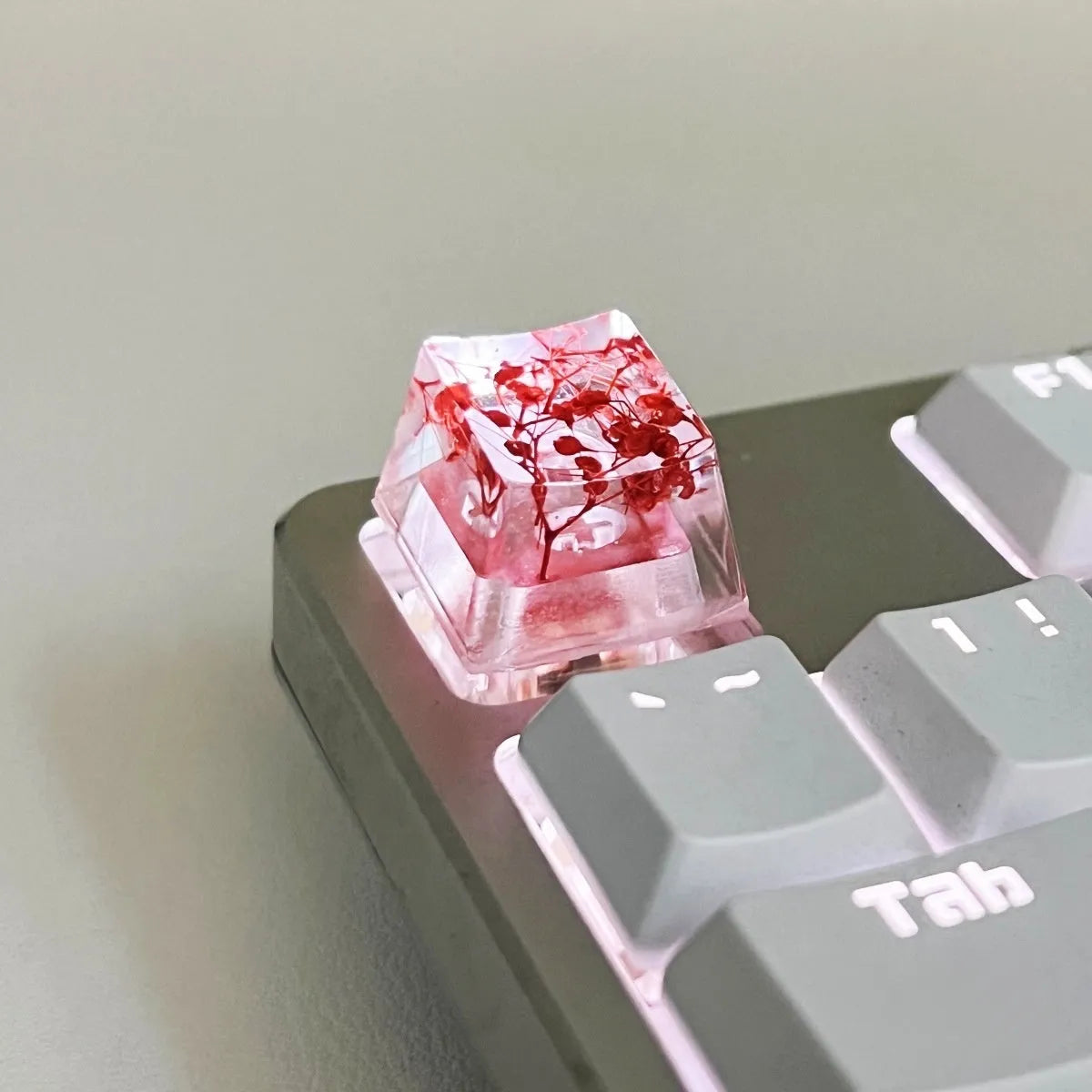 Transparent resin keycap with glitter particles creating starry night effect for mechanical keyboards
