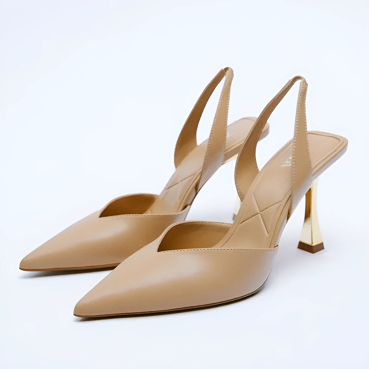 Women's pointed-toe patent leather high heels in apricot and black, showing shallow-cut vamp design.
