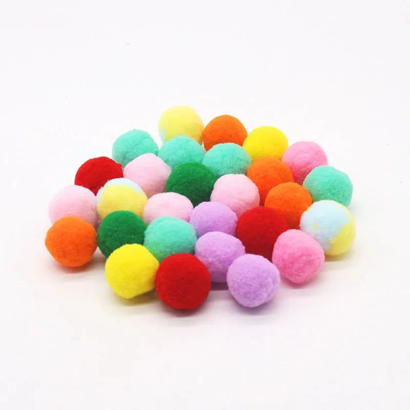 Pet toy launch gun with a selection of soft red plush balls for interactive dog and cat fetch games.