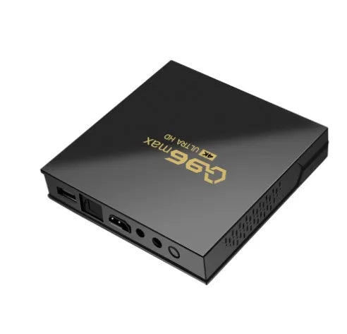 Q96 MAX S905 Android 4K TV set-top box with remote control and HDMI cable on a dark surface.