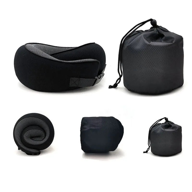 U-shaped navy blue memory foam travel neck pillow rolled up next to a mobile phone showing compact size