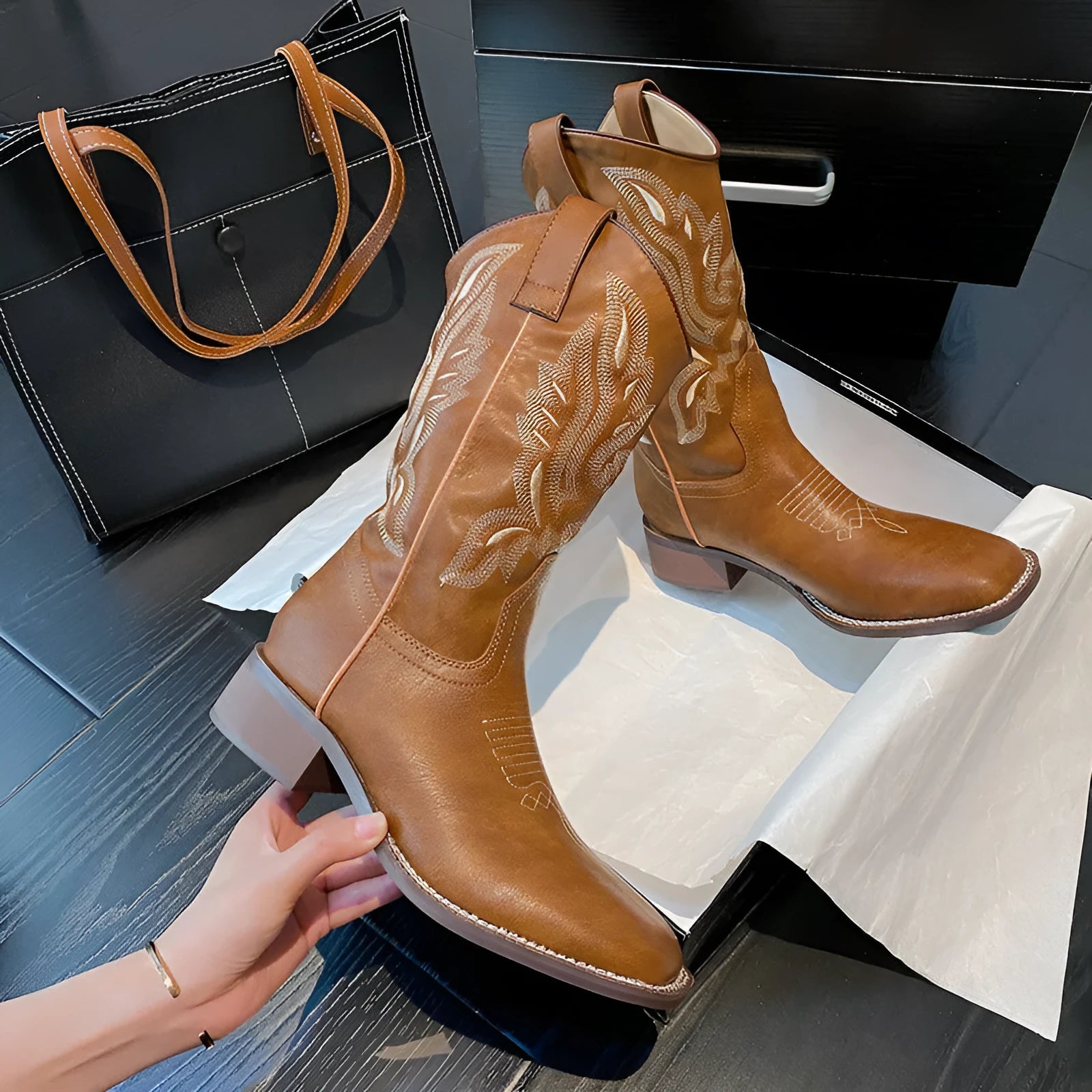 Brown women's embroidered mid-calf Martin boots with a low square heel and round toe.