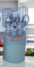 Stainless steel kitchen gadget set with peeler and whisk on grey tray