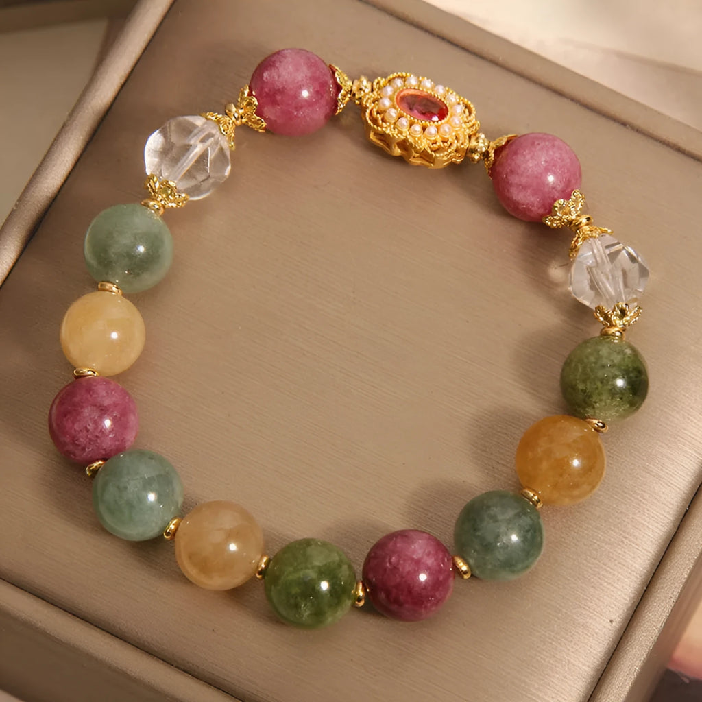 Close-up of a jade colour tourmaline bead bracelet on a pearl crystal base with alloy setting and rhinestones.