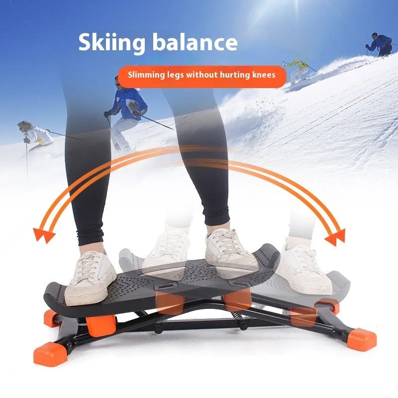 Black JS101A mini indoor fitness skiing machine with elastic hand straps on a flat surface.