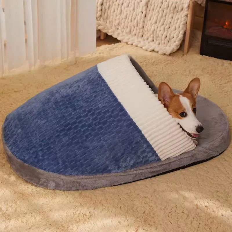 Blue dog nest sleeping bag with removable cover, shown with a small dog inside, fleece lining visible.
