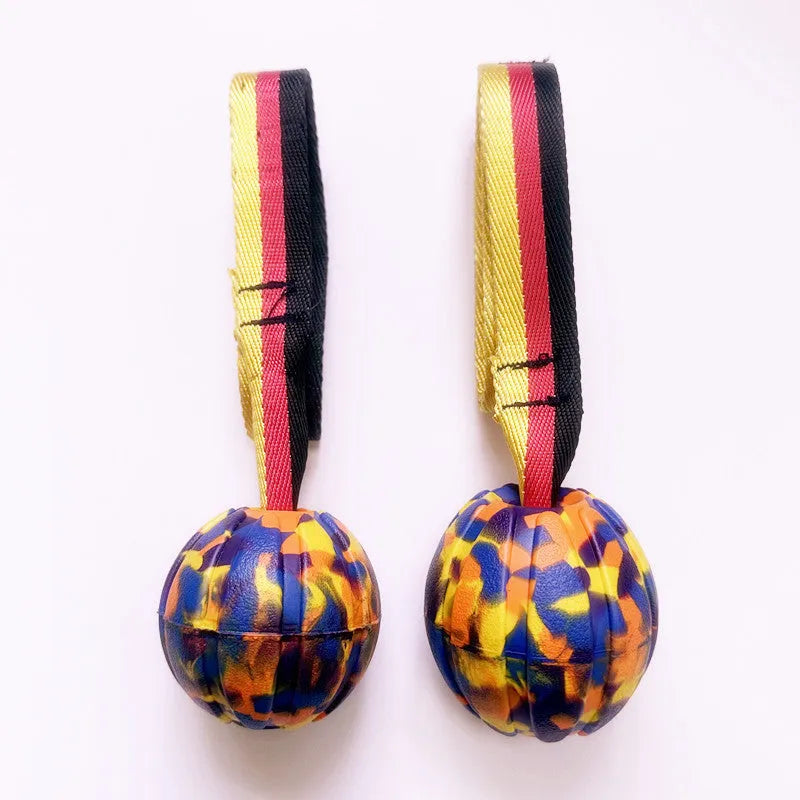 Yellow and camouflage EVA foam floating dog tetherballs in three different sizes for water fetch