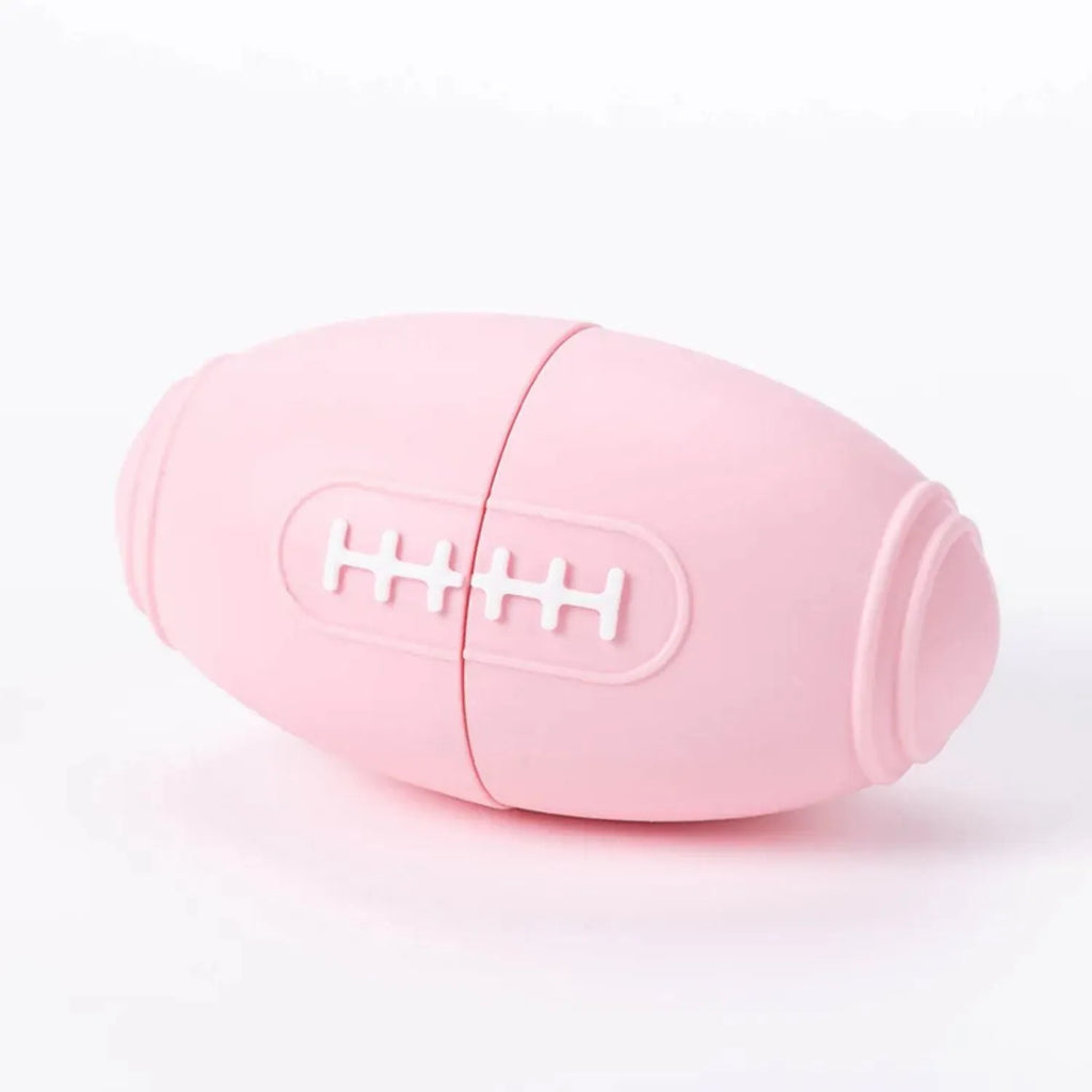 Blue silicone rugby ball dog toy with hollow treat-dispensing centre