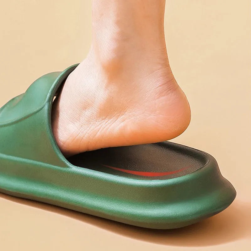 A pair of soft, thick-soled EVA flip-flop slippers in a chosen colour, showing the non-slip tread pattern on the sole.
