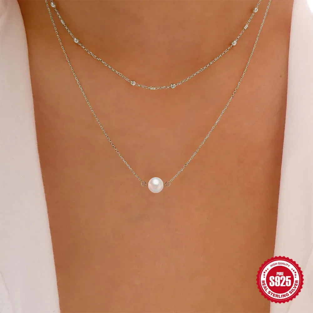 Women's sterling silver double layer twin pearl necklace with a ball bead chain in gold colour.