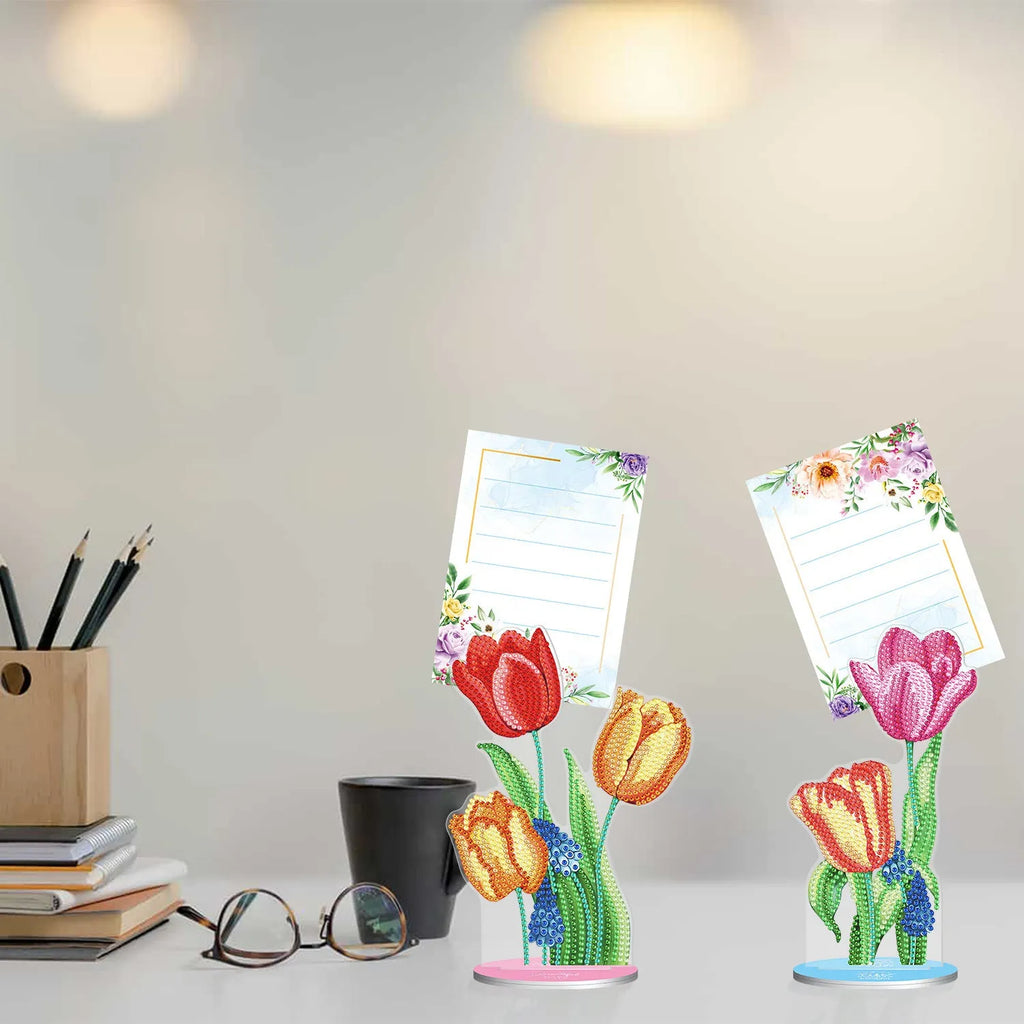 Handmade frameless diamond painting decorative note clip holder on a tabletop.
