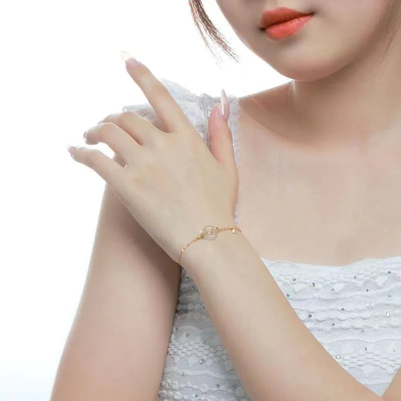 Women's silver bracelet with white chalcedony and starry sky design featuring peace buckle