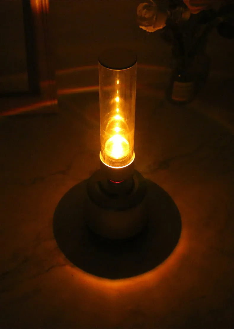 White silver candlelight Bluetooth speaker night light with modern simple design.