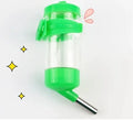 Green plastic ball kettle pet water feeder with leak-proof design mounted on a cage.