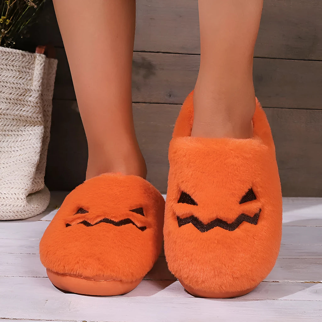 Orange plush Halloween pumpkin slippers with a coral velvet upper and non-slip sole