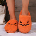 Orange plush Halloween pumpkin slippers with a coral velvet upper and non-slip sole