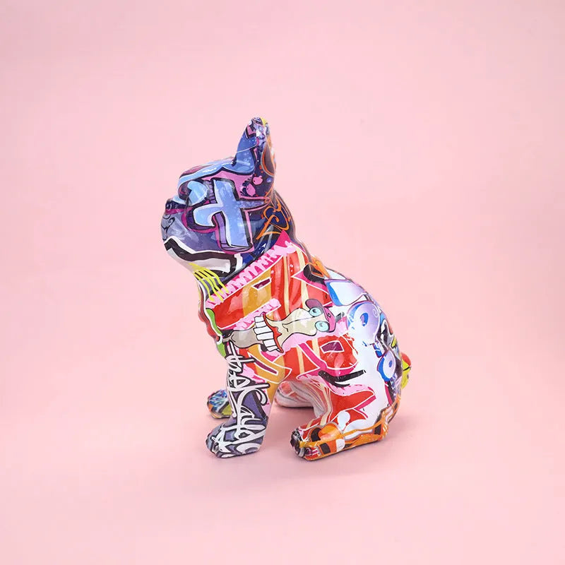 Graffiti coloured solid resin French Bulldog statue on a white background.