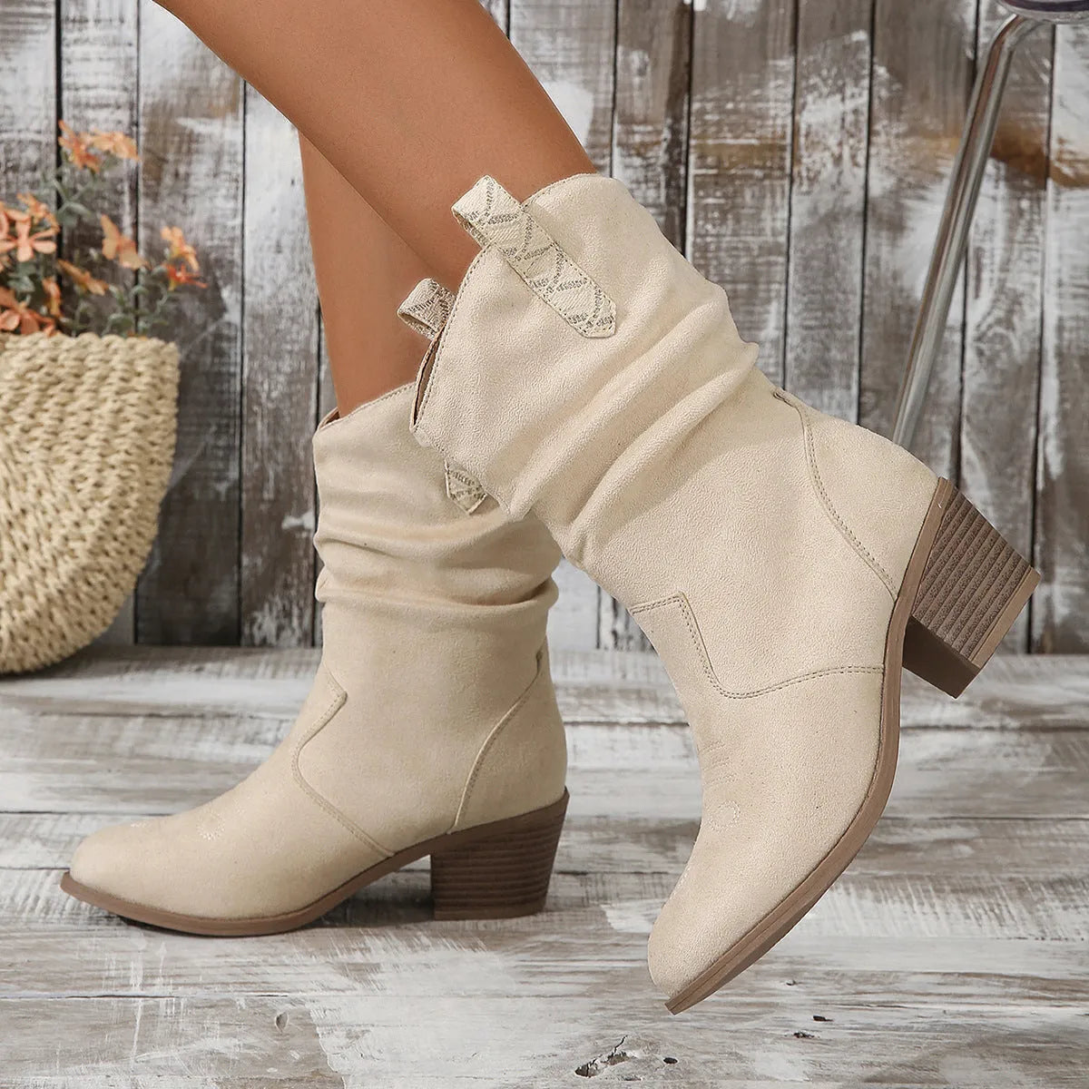Women's mid-calf suede boots with a pointed toe and short stout heel in lotus root colour.