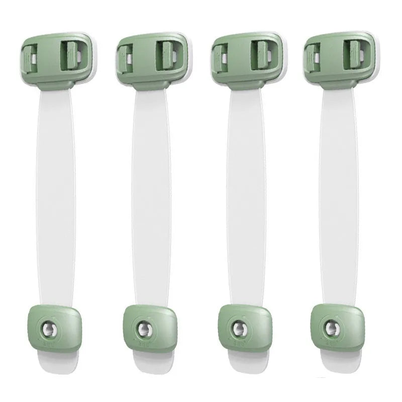 Grey and green adjustable child safety cabinet locks with adhesive backing on a kitchen drawer.