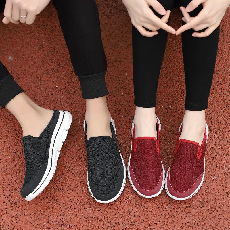 Women's light grey mesh toe holder slippers with a flat sole on a white background.